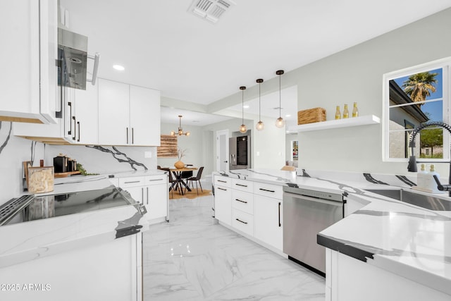 2926 N 16th Ave, Phoenix, AZ 85015 - kitchen featuring light stone counters, a peninsula, visible vents, stainless steel dishwasher, and marble finish floor