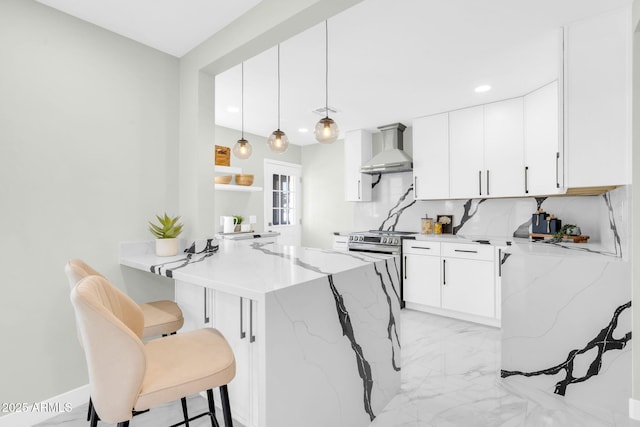 2926 N 16th Ave, Phoenix, AZ 85015 - kitchen featuring a kitchen breakfast bar, electric range, a peninsula, wall chimney range hood, and marble finish floor