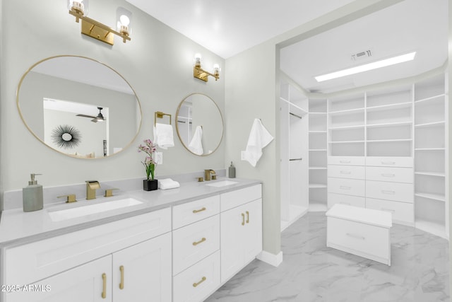 2926 N 16th Ave, Phoenix, AZ 85015 - full bathroom featuring a sink, a walk in closet, double vanity, and marble finish floor