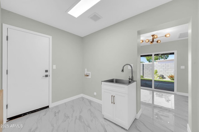 2926 N 16th Ave, Phoenix, AZ 85015 - laundry area featuring baseboards, washer hookup, cabinet space, marble finish floor, and a sink