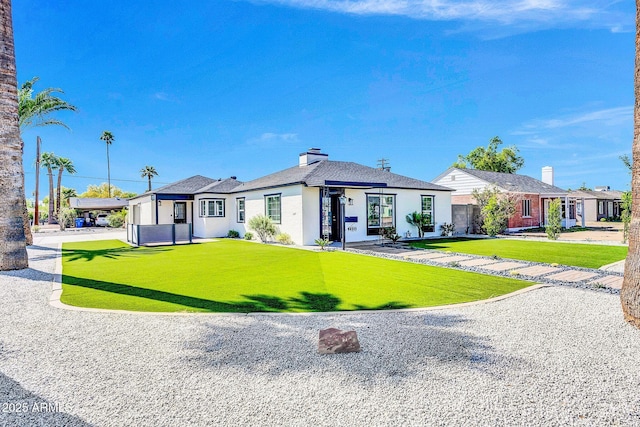 2926 N 16th Ave, Phoenix, AZ 85015 - view of front of house featuring a front yard and a chimney