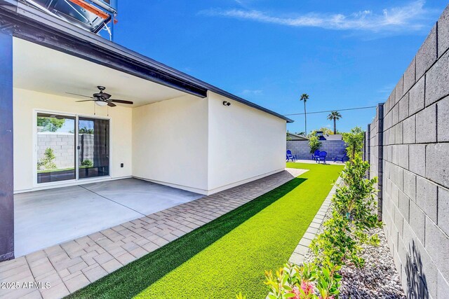 2926 N 16th Ave, Phoenix, AZ 85015 - view of yard with a patio, a fenced backyard, and a ceiling fan