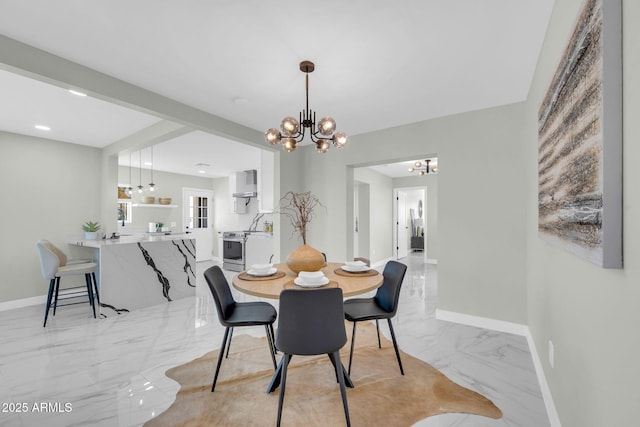 2926 N 16th Ave, Phoenix, AZ 85015 - dining area featuring a notable chandelier, marble finish floor, and baseboards