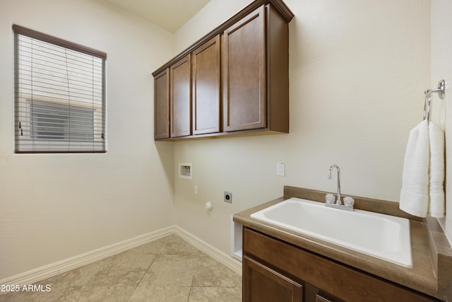 washroom with cabinets, washer hookup, hookup for an electric dryer, and sink