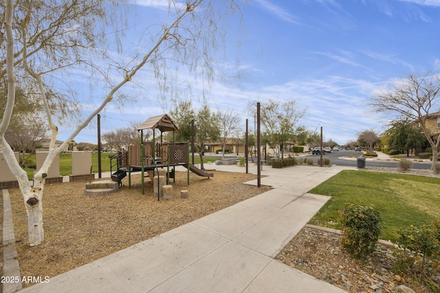 view of playground with a lawn