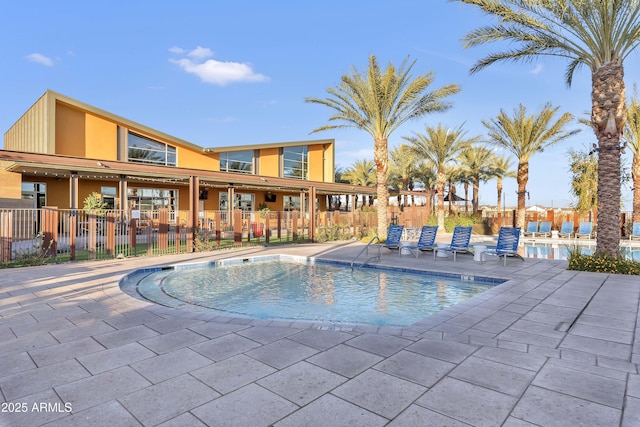 view of swimming pool with a patio area