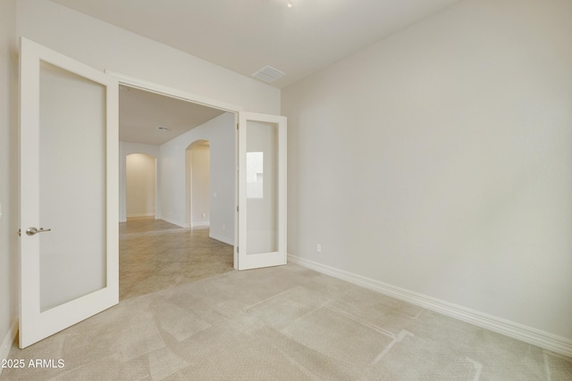 spare room with light colored carpet