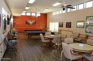 dining space featuring wood finished floors, a healthy amount of sunlight, and ceiling fan