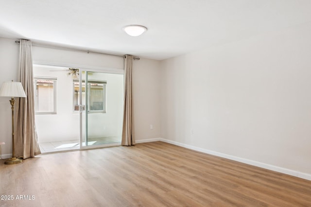 unfurnished bedroom featuring a closet, baseboards, and wood finished floors