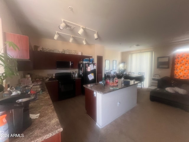 kitchen featuring black appliances and a kitchen island