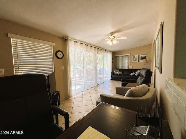 tiled living room featuring ceiling fan