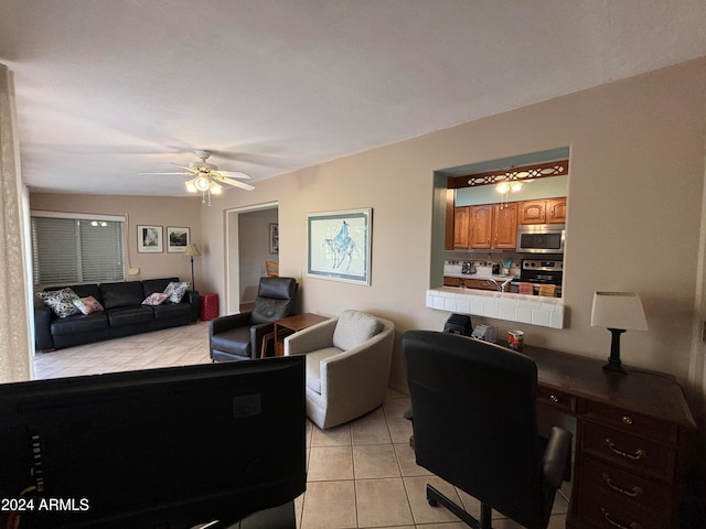 living room featuring ceiling fan and light tile patterned floors