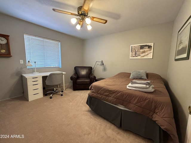 bedroom with light carpet and ceiling fan