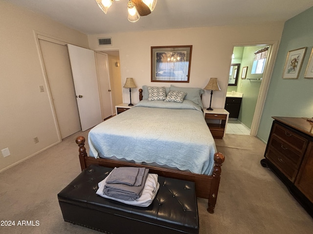 carpeted bedroom featuring ceiling fan and connected bathroom