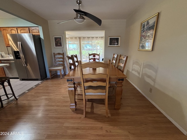 dining room featuring light hardwood / wood-style flooring and ceiling fan