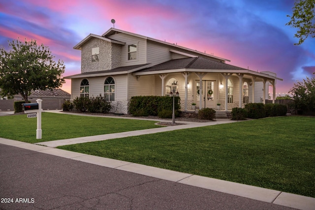 view of front of house with a front lawn and a porch