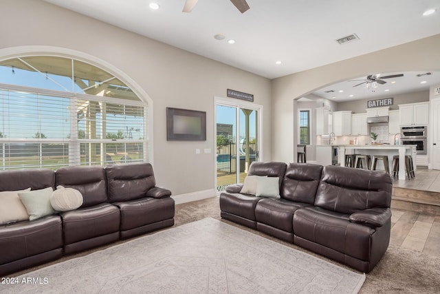 living room featuring visible vents, recessed lighting, baseboards, and ceiling fan