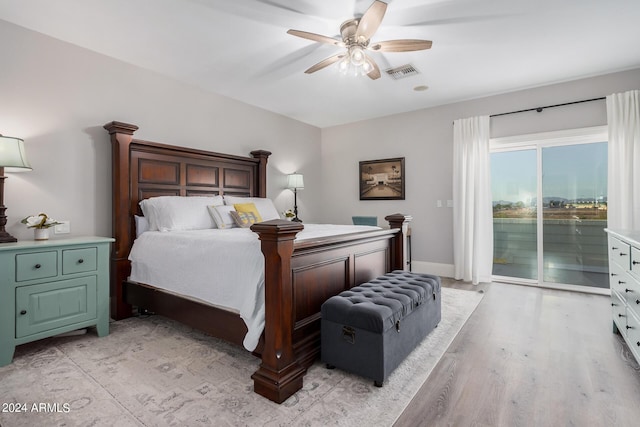 bedroom featuring a ceiling fan, visible vents, baseboards, access to exterior, and light wood-style floors