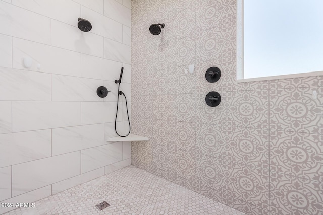 bathroom with tiled shower