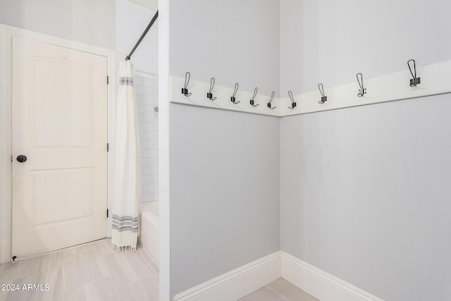 mudroom with light tile patterned floors