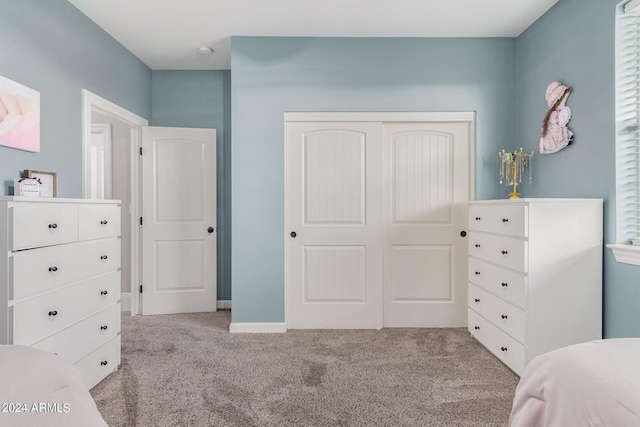 bedroom featuring a closet and carpet