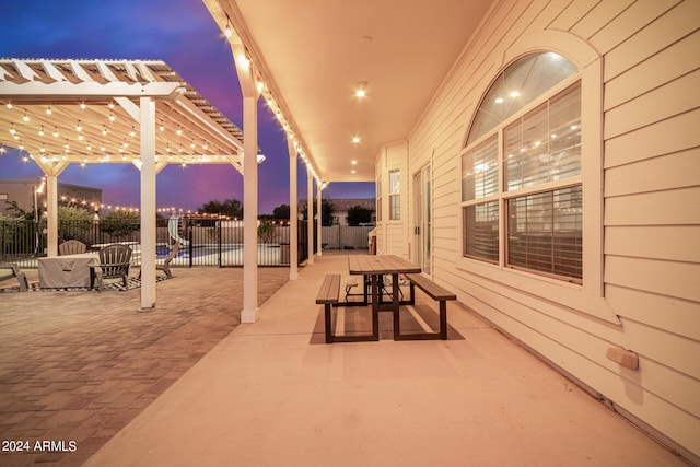 view of patio featuring fence and a pergola