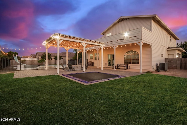 back of house with fence, a yard, a patio area, and a pergola