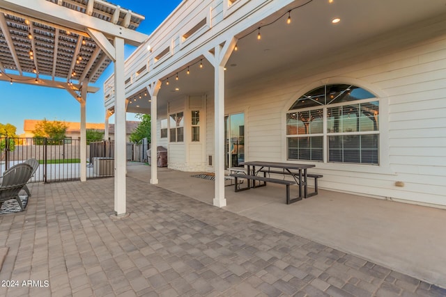 view of patio / terrace featuring a pergola and fence