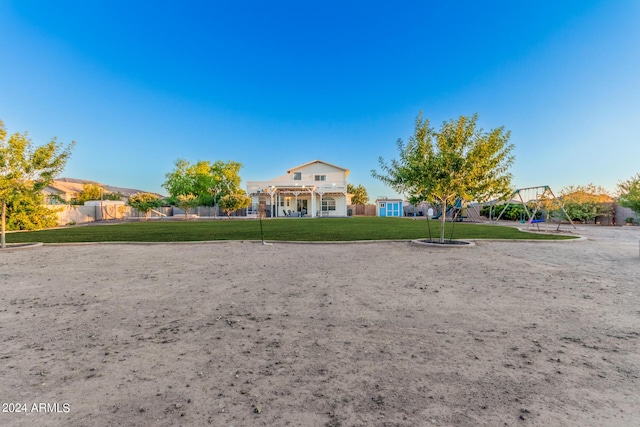 exterior space featuring a lawn and playground community