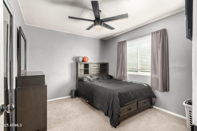 bedroom with baseboards, ceiling fan, and light colored carpet