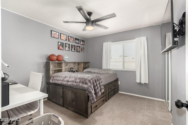 bedroom with baseboards, a ceiling fan, and light colored carpet