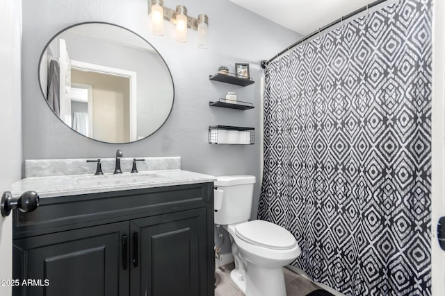 bathroom with toilet, vanity, and a shower with curtain