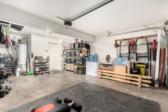 garage with water heater and a garage door opener