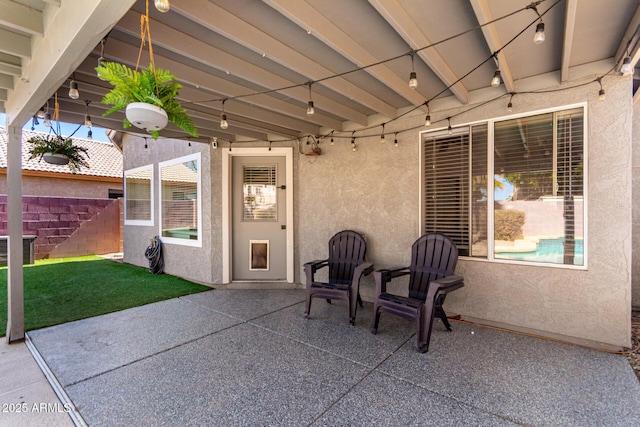 view of patio featuring fence