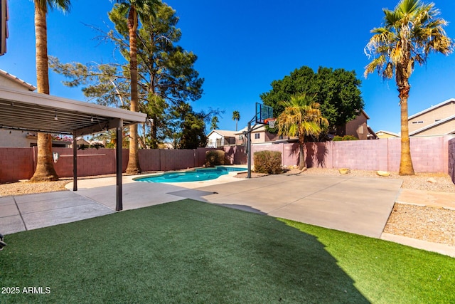 view of yard with a patio area, a fenced backyard, and a fenced in pool