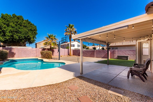 view of pool featuring a patio area, a fenced backyard, and a fenced in pool