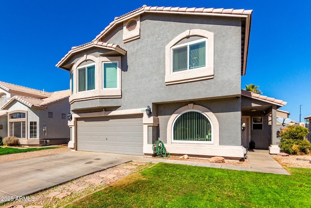 view of front of property with a garage, driveway, a tiled roof, stucco siding, and a front lawn