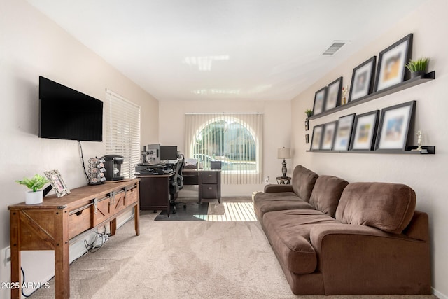 office with light carpet and visible vents