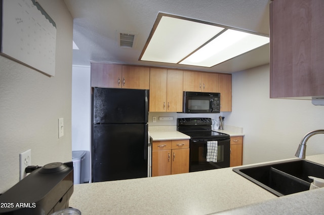 17032 N 16th Dr Unit 8, Phoenix, AZ 85023 - kitchen with black appliances, a sink, and light countertops