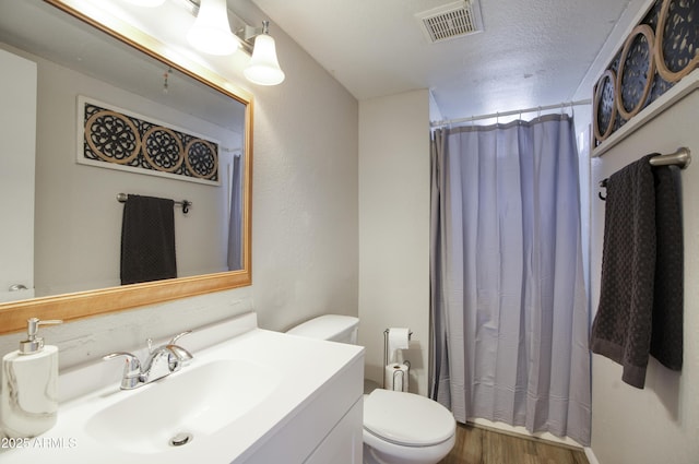 17032 N 16th Dr Unit 8, Phoenix, AZ 85023 - full bath featuring toilet, vanity, wood finished floors, and a shower with shower curtain