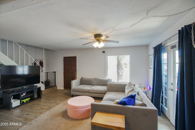 17032 N 16th Dr Unit 8, Phoenix, AZ 85023 - living room with light wood-type flooring, stairway, and a ceiling fan