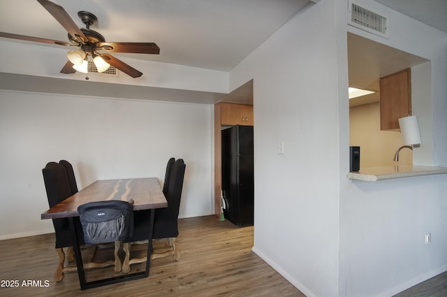 17032 N 16th Dr Unit 8, Phoenix, AZ 85023 - dining space featuring wood finished floors, a ceiling fan, and baseboards