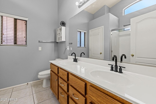 878 E Mountain View Rd, San Tan Valley, AZ 85143 - full bathroom featuring double vanity, tile patterned floors, and a shower with door