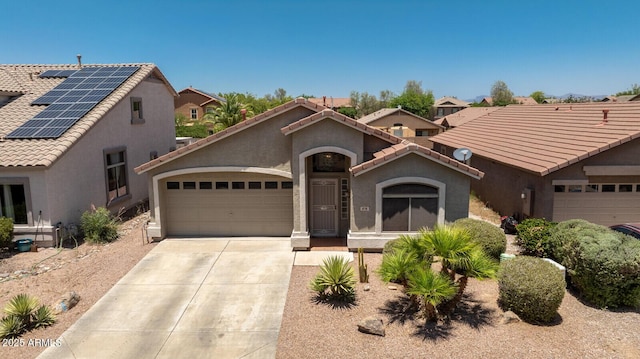878 E Mountain View Rd, San Tan Valley, AZ 85143 - mediterranean / spanish-style home with stucco siding, an attached garage, a tile roof, concrete driveway, and solar panels