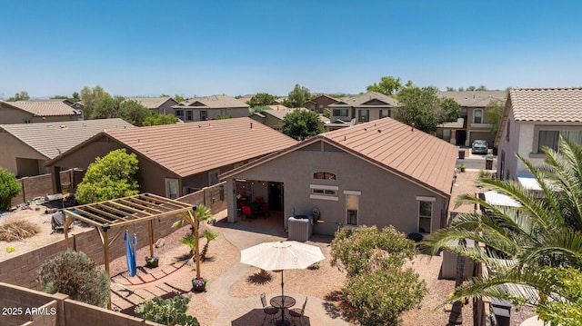 878 E Mountain View Rd, San Tan Valley, AZ 85143 - back of house featuring a patio, a residential view, and stucco siding