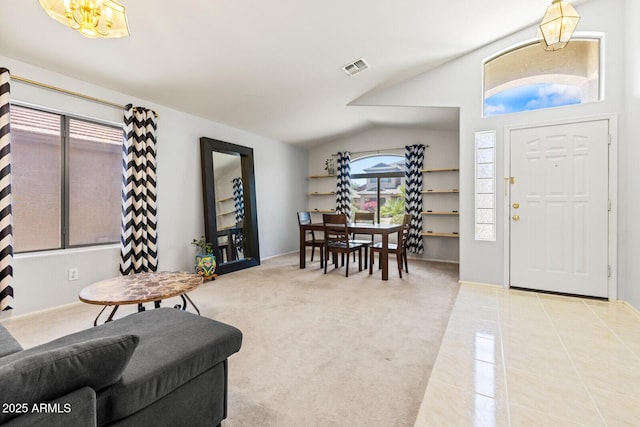 878 E Mountain View Rd, San Tan Valley, AZ 85143 - carpeted foyer entrance with vaulted ceiling, tile patterned flooring, and a chandelier