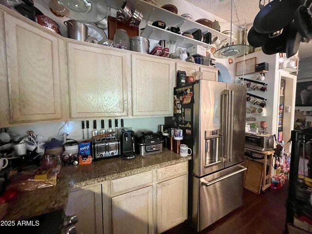 kitchen with stainless steel fridge and dark wood-style floors