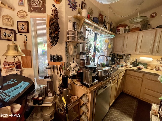 kitchen with stainless steel dishwasher, light brown cabinetry, and a sink