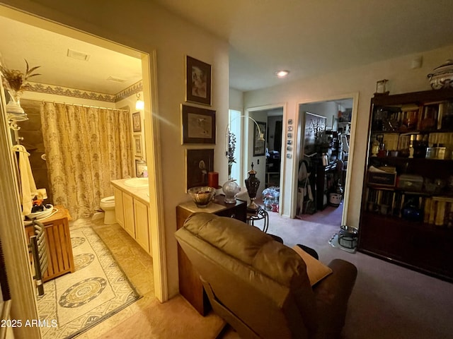 full bath with toilet, curtained shower, and vanity