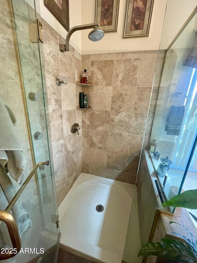 full bathroom featuring a shower stall